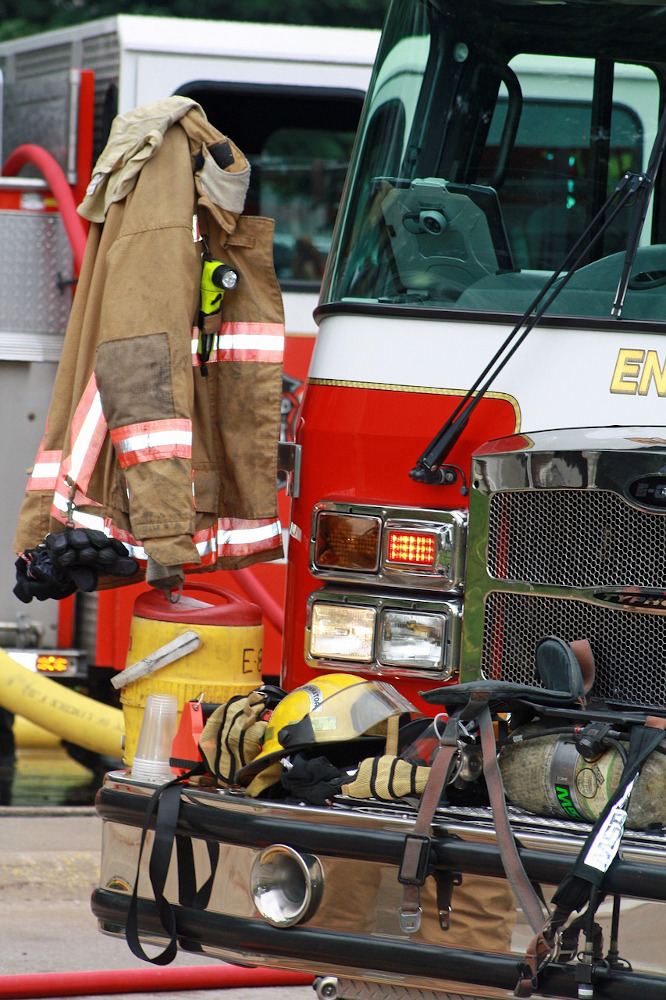 Fire fighting equipment next to a fire engine.
